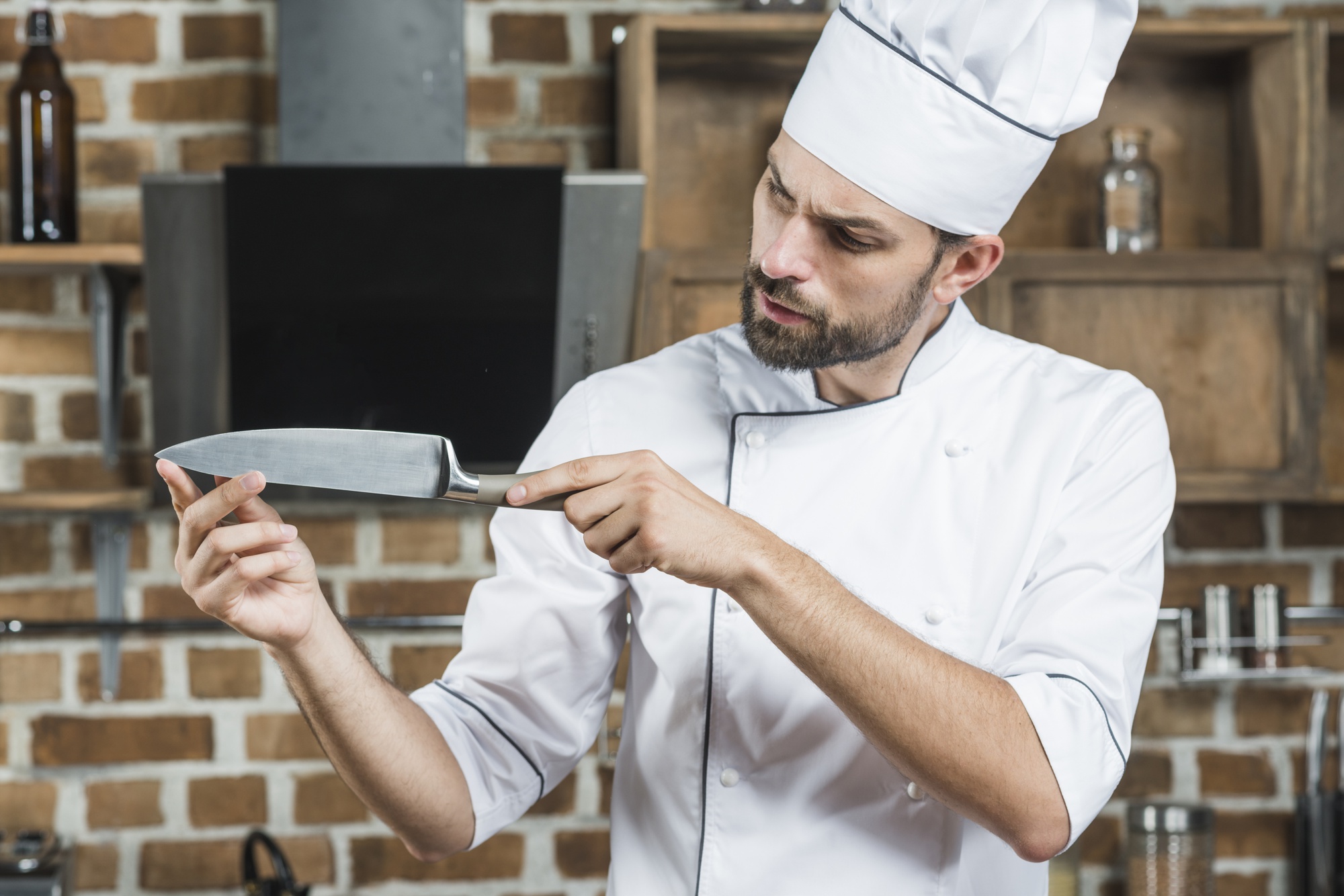 Chef demonstrating knife technique to students